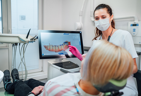 Dentist showing a patient a digital impression of their teeth