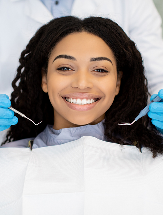 Woman smiling during a dental checkup
