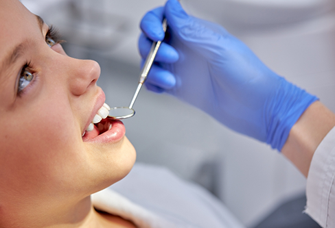 Young woman receiving a dental exam