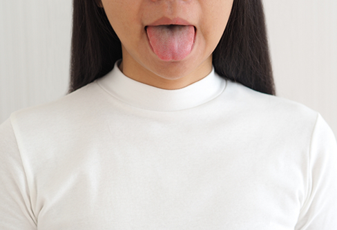Person sticking out their tongue
