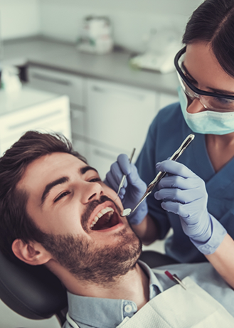 Dentist examining a patient's teeth