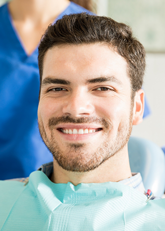 Smiling man sitting in the dental chair